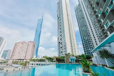 a swimming pool in a city with tall buildings at Swiss Garden Residence by Aspire Suites in Kuala Lumpur