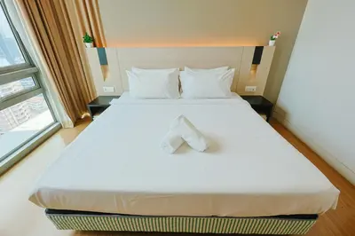 a bedroom with a bed with a towel on it at Swiss Garden Residence by Aspire Suites in Kuala Lumpur