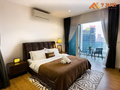 a bedroom with a bed and a balcony with a view at Quill Residence 1R1B with Netflix 23F&Massive Pool in Kuala Lumpur