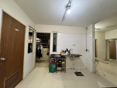 a kitchen with a sink and a table in a room at Male Room at Plaza Rah, KL City Centre in Kuala Lumpur