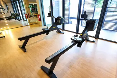 a gym with treadmills and ellipticals in a building at Stylish M Vertica 4 Bedroom Walk to MRT Velocity Mall in Kuala Lumpur