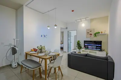 a living room with a couch and a table at Stylish M Vertica 4 Bedroom Walk to MRT Velocity Mall in Kuala Lumpur