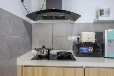 a kitchen with a stove top with a pot on it at Stylish M Vertica 4 Bedroom Walk to MRT Velocity Mall in Kuala Lumpur