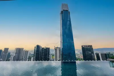 a swimming pool with a view of a city at #TRX KL #2BR #4Pax #2Gbps #Netflix #Hotel Feel in Kuala Lumpur