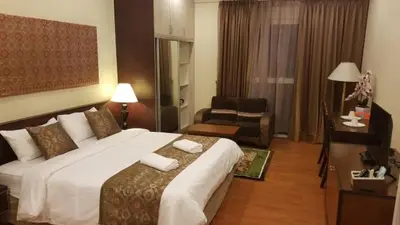 a bedroom with a large bed in a hotel room at Maytower Apartment Studio Kuala Lumpur in Kuala Lumpur