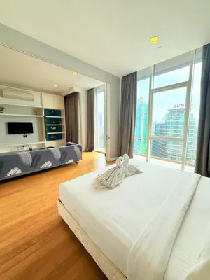 a bedroom with a large bed and a large window at The Platinum KLCC By Homestay in Kuala Lumpur