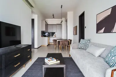 a living room with a couch and a table at Opus by Soulasia in Kuala Lumpur