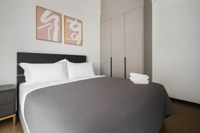 a bedroom with a large bed in a room at Opus by Soulasia in Kuala Lumpur