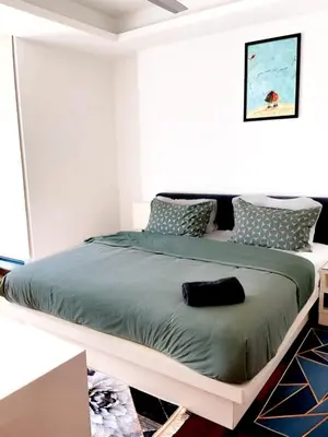 a bedroom with a large bed in a room at Casa Residency apartment by Classy Homes in Kuala Lumpur