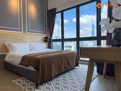 a bedroom with a bed and a desk and a window at KL &118 Tower View 1R1B Netflix 19F & Best View Infinity Pool in Kuala Lumpur