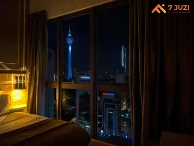 a room with a window with a view of a city at night at KL &118 Tower View 1R1B Netflix 19F & Best View Infinity Pool in Kuala Lumpur