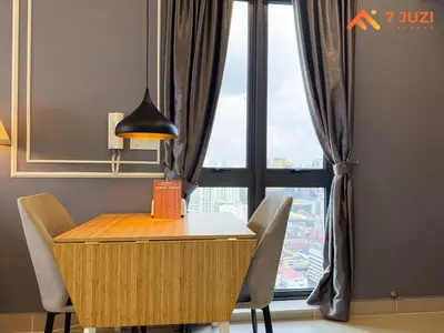 a desk with chairs and a lamp in front of a window at KL &118 Tower View 1R1B Netflix 19F & Best View Infinity Pool in Kuala Lumpur