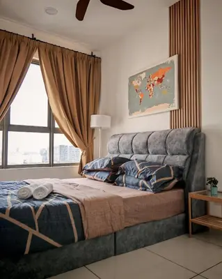 a bedroom with a large bed and a window at View KLCC 3 Bedroom Homestay Kenwingston Platz in Kuala Lumpur