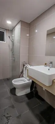 a bathroom with a toilet and a sink and a shower at Puncak Sentul KL with 3 Bedroom Homestay in Kuala Lumpur