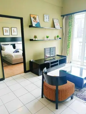 a room with a desk and a bed and a mirror at Seri Bukit Ceylon Dreamy Destiny luxe Suites in Kuala Lumpur