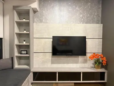 a living room with a flat screen tv on a wall at Ceylonz Suites Bukit Bintang By ICEFLY in Kuala Lumpur