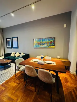 a living room with a table and a couch at KLCC The Mews Luxury suites Malaysia in Kuala Lumpur