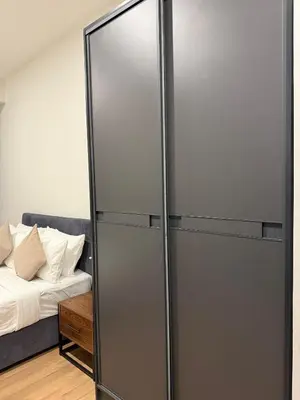 a sliding glass door in a room with a bed at Cyelonz Suites in Kuala Lumpur