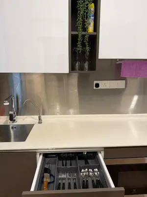 a kitchen with a sink and a counter top at Cyelonz Suites in Kuala Lumpur