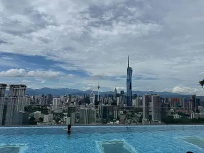 a swimming pool with a view of a city at City View Retreat in Kuala Lumpur