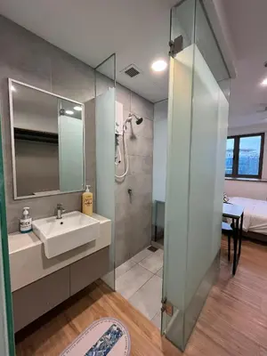 a bathroom with a sink and a shower at City View Retreat in Kuala Lumpur