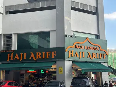 a building with a sign for a haikiarmaarmaastery at KL City 3BR 3Bath Condo , Razak city ,TV box & Pool in Kuala Lumpur