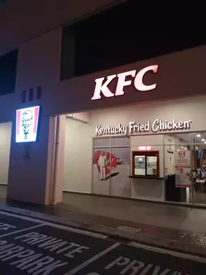 a kryptonian fired chicken store with a sign on it at Simple Comforts KL Shared apt in Kuala Lumpur