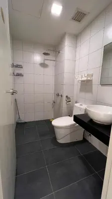 a bathroom with a toilet and a sink at Cozy Chambers Studio KLCC Grand Opening Sale in Kuala Lumpur