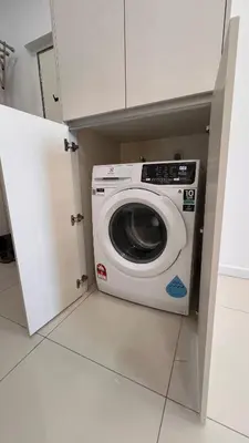 a washer and dryer in a small kitchen at Cozy Chambers Studio KLCC Grand Opening Sale in Kuala Lumpur