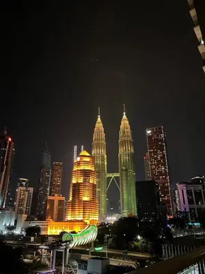 a group of tall buildings in a city at night at Legasi Kampong Baru By AMNA for Malay Only in Kuala Lumpur