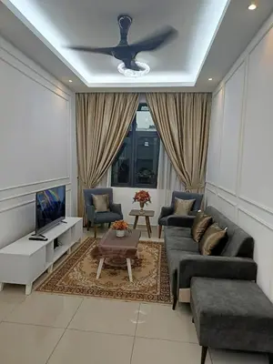 a living room with a couch and a ceiling fan at Legasi Kampong Baru By AMNA for Malay Only in Kuala Lumpur