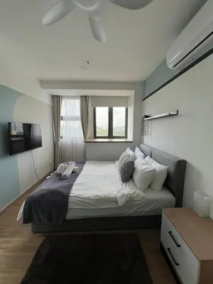 a bedroom with a large bed with a window at TheRiv Boutique Suites at Riveria City KL Sentral by Suite Dwellings in Kuala Lumpur