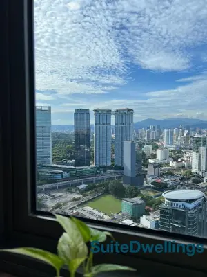 a view of a city from a window at TheRiv Boutique Suites at Riveria City KL Sentral by Suite Dwellings in Kuala Lumpur