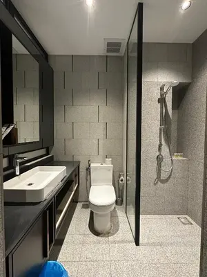 a bathroom with a toilet and a sink and a shower at SKYLINE HOME BY SCARLETZ SUITEs KLCC in Kuala Lumpur