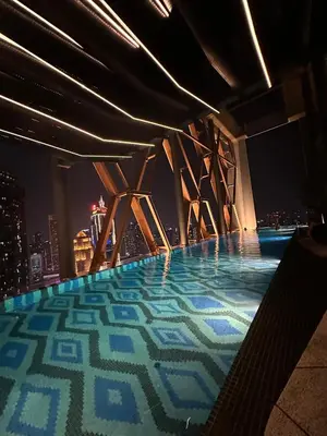 a pool on the top of a building with a city skyline at SKYLINE HOME BY SCARLETZ SUITEs KLCC in Kuala Lumpur