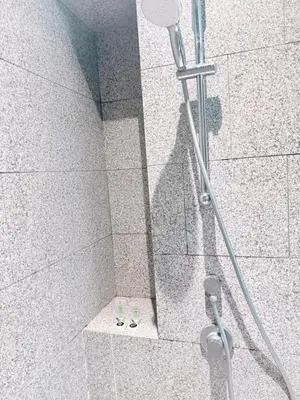 a shower stall with a shower head in a bathroom at Scarletz Suites KLCC by Dream in Kuala Lumpur