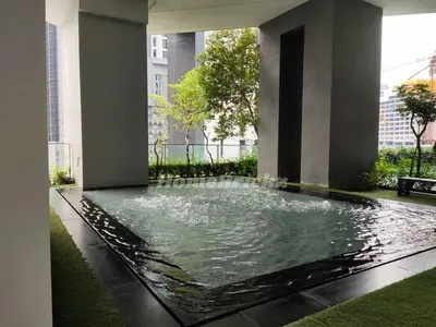 a large pool of water in a building at The Mews KLCC by Homebrickz in Kuala Lumpur