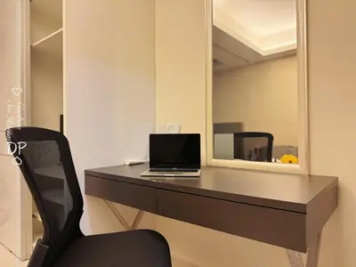 a laptop computer sitting on a desk with a mirror at Damas Suite Sri Hartamas 4 pax Link to Mall in Kuala Lumpur