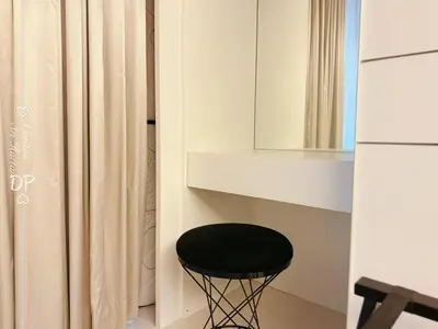 a black stool sitting in a bathroom next to a mirror at Damas Suite Sri Hartamas 4 pax Link to Mall in Kuala Lumpur