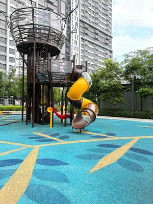 a playground with a slide in a park at Ourstay M Vertica 49th floor Kuala Lumpur City View near Ikea with level 1 car park & 6 minutes walk to Maluri MRT in Kuala Lumpur