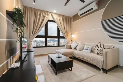 a living room with a couch and a table at Trendy 3BR MVertica Near MRT by RumaBnB in Kuala Lumpur