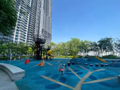 a park with a playground in a city at Trendy 3BR MVertica Near MRT by RumaBnB in Kuala Lumpur