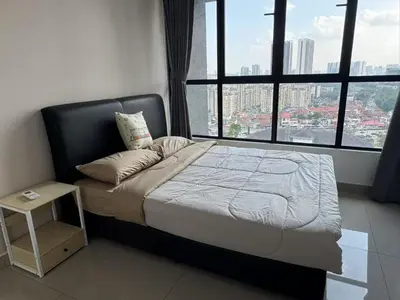 a bed in a room with a large window at lavile 3 \u623f in Kuala Lumpur