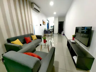 a living room with two couches and a television at lavile residence in Kuala Lumpur