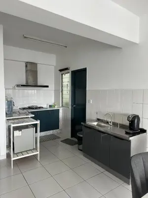 a kitchen with a sink and a counter top at Cozy 2BR Apt AxisAtrium Mall wPool Pandan Indah Ampang Kuala Lumpur in Ampang