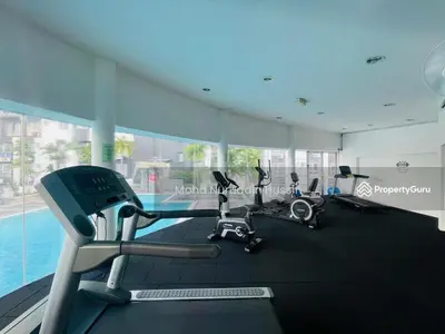 a gym with cardio equipment in a building with a pool at Cozy 2BR Apt AxisAtrium Mall wPool Pandan Indah Ampang Kuala Lumpur in Ampang