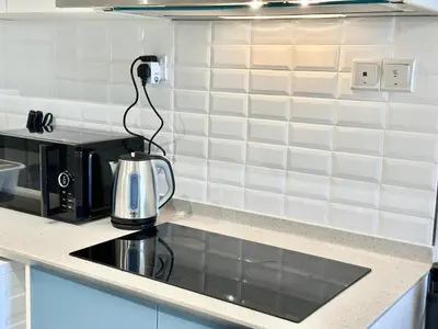 a tea kettle sitting on a counter in a kitchen at 7Pax Muji Continew KL Centre View 10mins to TRX KLCC IKEA in Kuala Lumpur