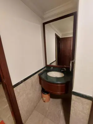 a bathroom with a sink and a mirror at Rainfall Suite And Service at Time Squre KL in Kuala Lumpur
