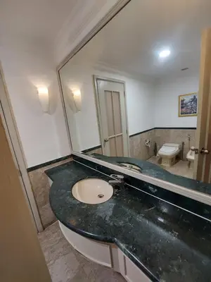 a bathroom with a sink and a mirror at Rainfall Suite And Service at Time Squre KL in Kuala Lumpur