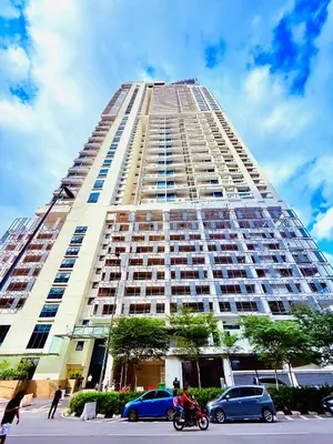 a large building with cars parked in front of it at Colony Relax Residences Klcc in Kuala Lumpur